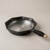 The Finex skillet — octagonal rim and coiled spring handle